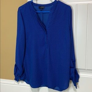 blue top with white polka dots